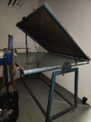 Tilting glass top vacuum table