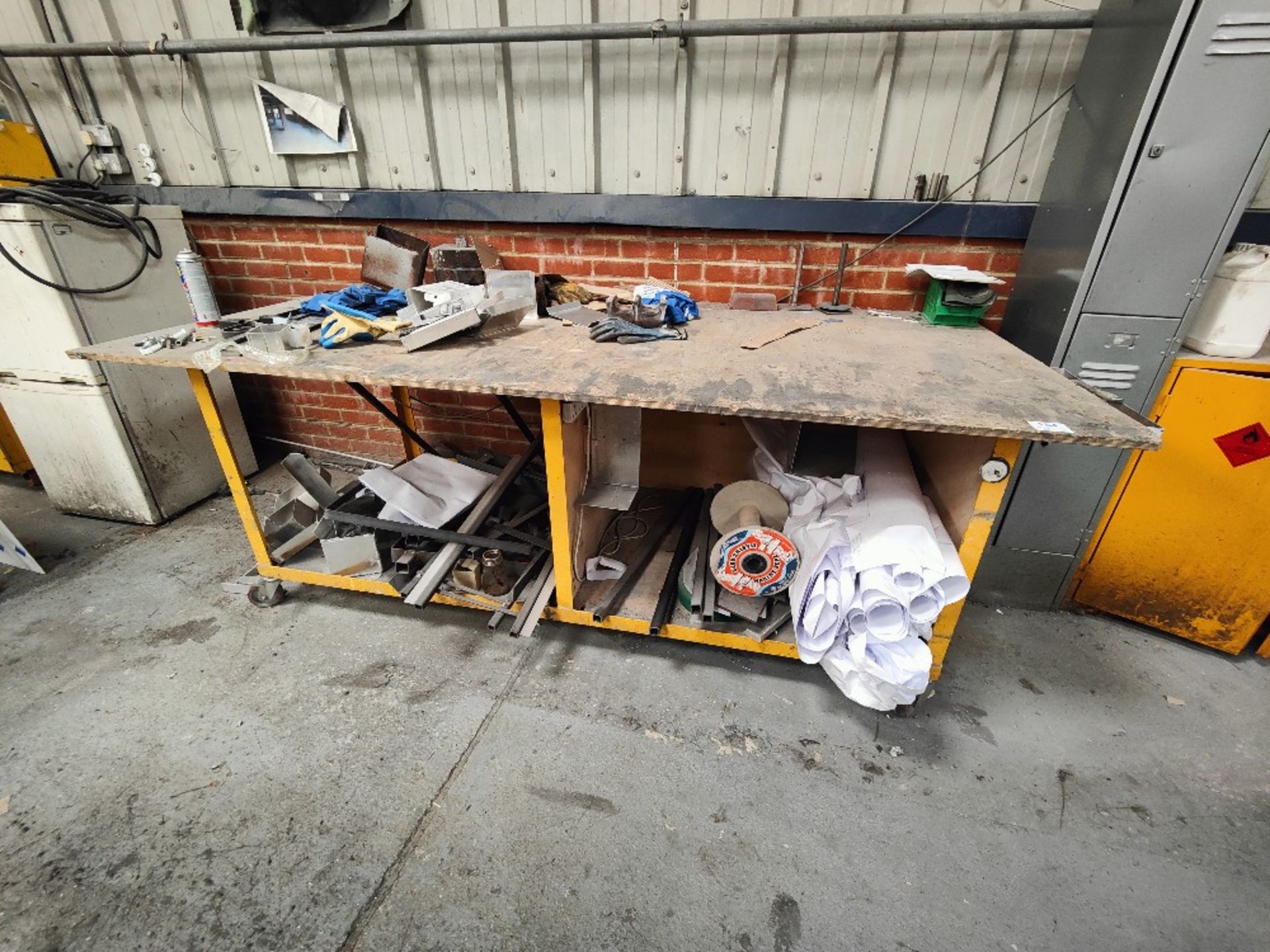 Mobile wooden workbench with contents