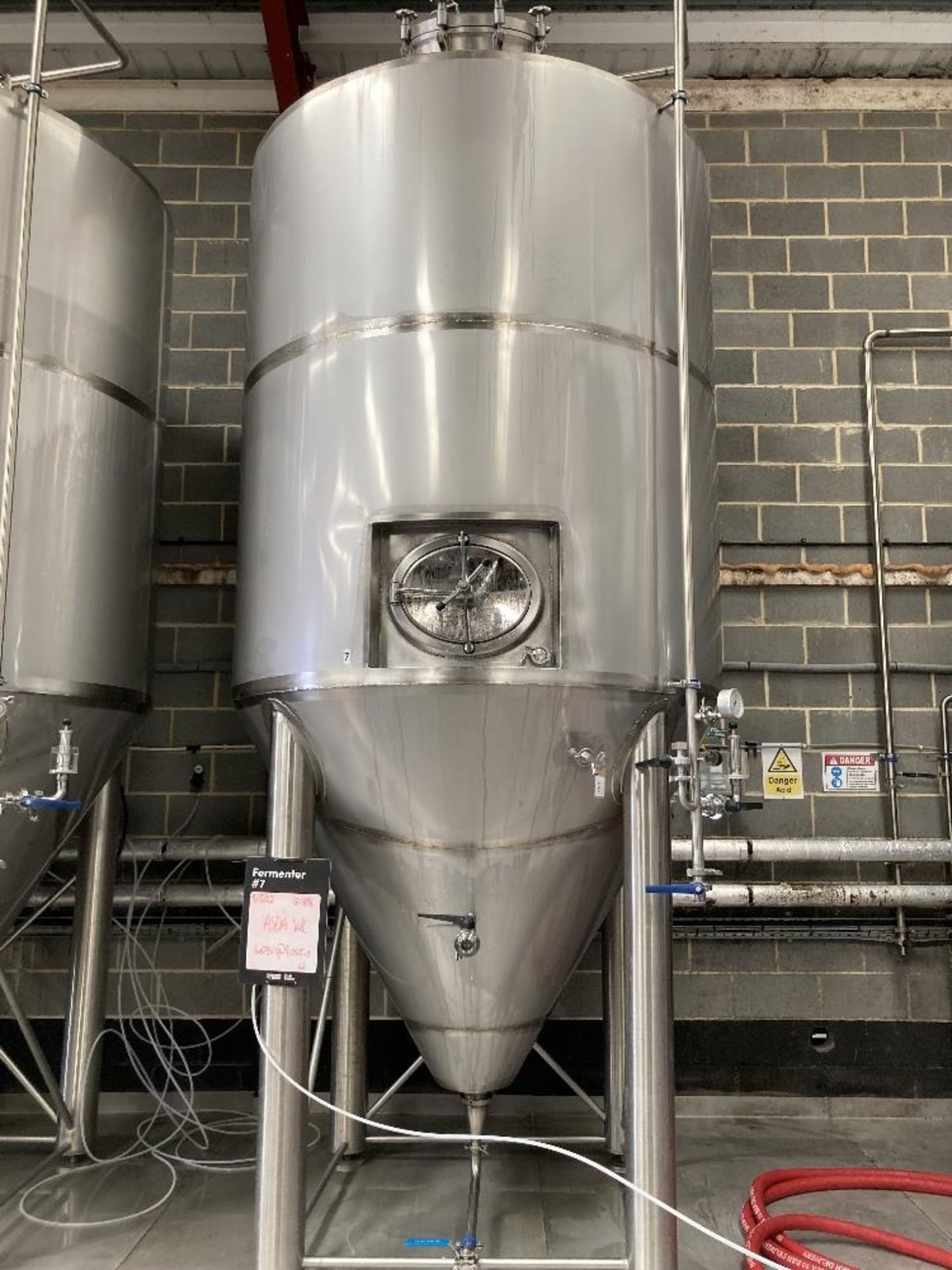 Unbranded stainless steel pressurised vertical conical vessel