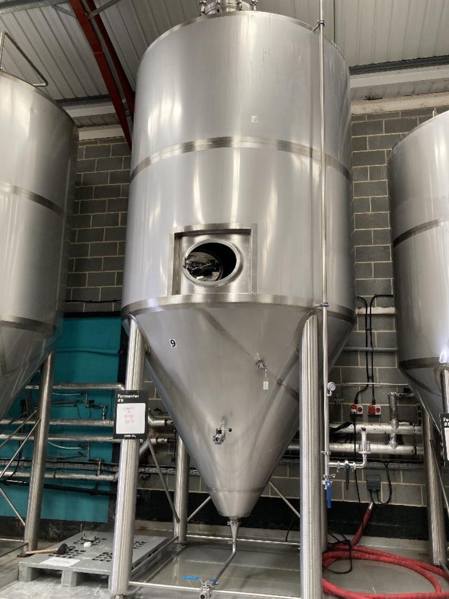 Unbranded stainless steel pressurised vertical conical vessel