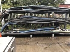 Large Quantity of Suction & Delivery Hoses & Storage Rack