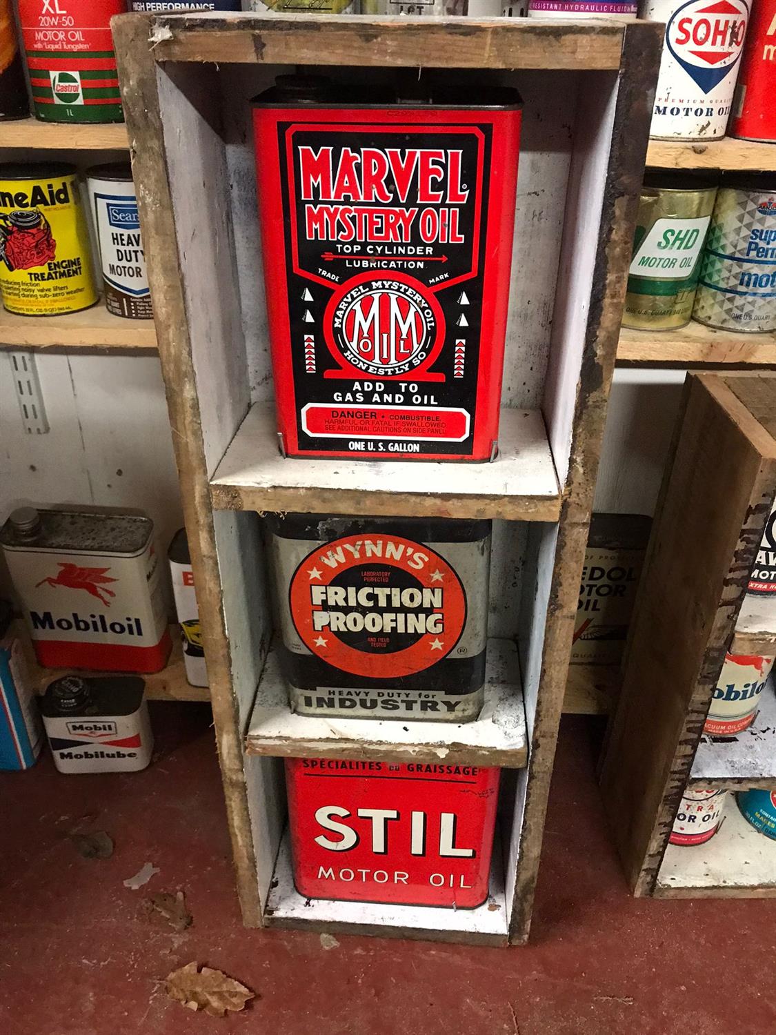 American and French Themed Cans in Rustic Display case