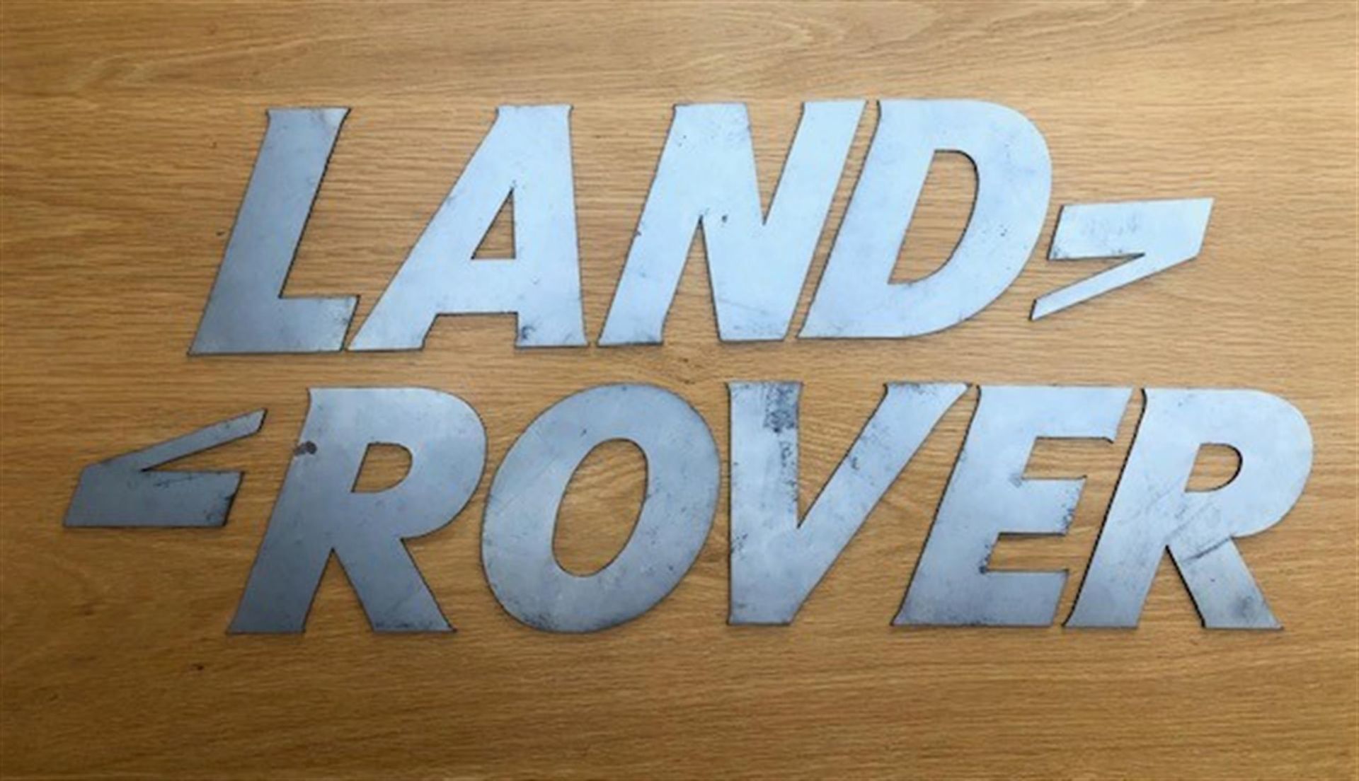 A font-correct 'Land Rover' sign in lazered-steel cut-outs