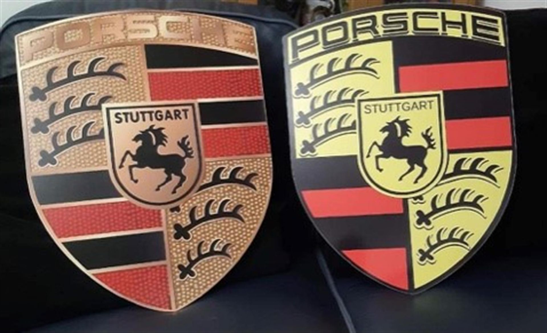 A Superb and Much Sought After Pair of Porsche Dealership-Type Metal Wall Signs