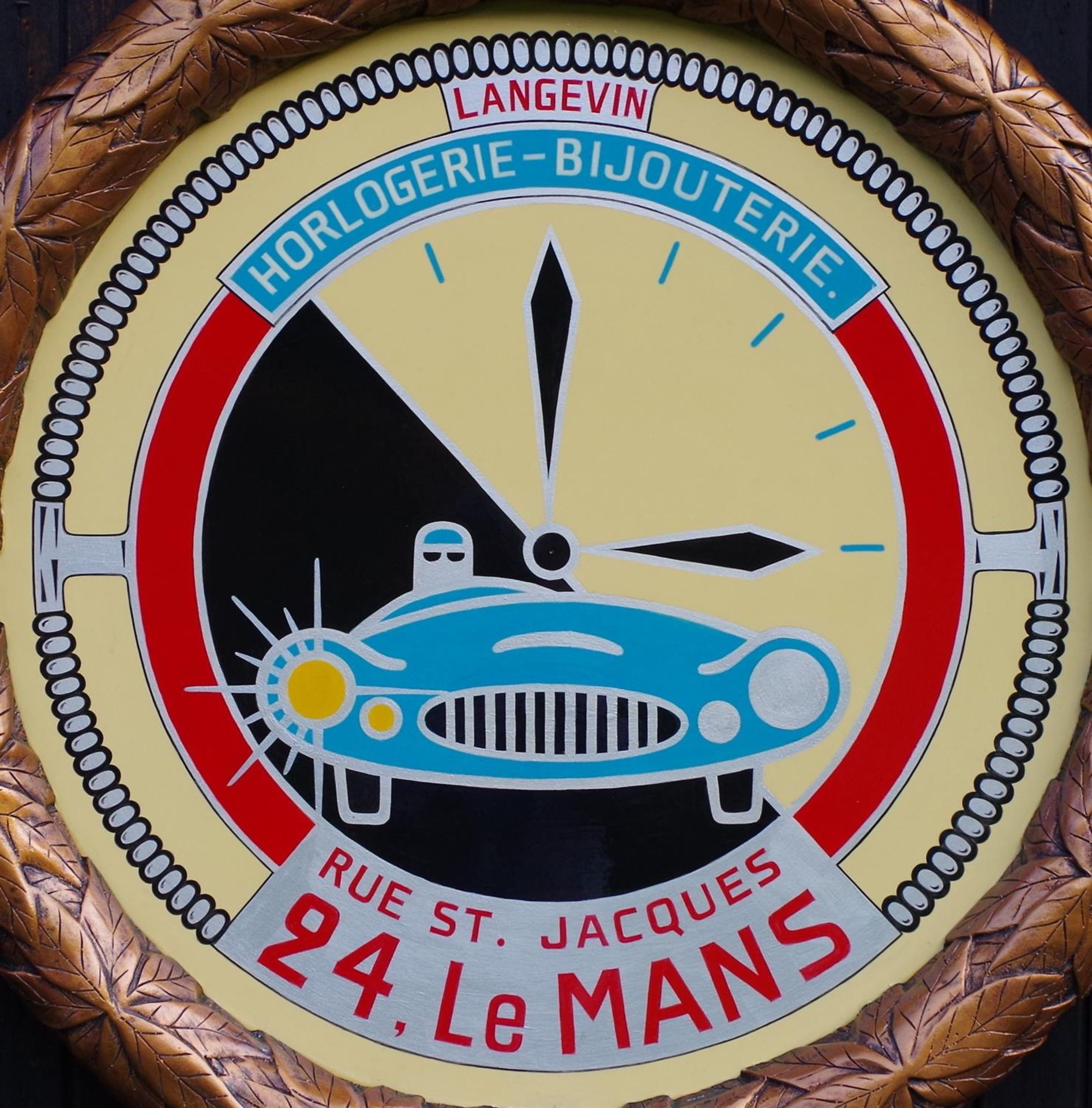 Le Mans Clock Roundel in the style of a Watchmakers Shop display.