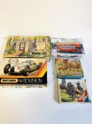 Five boxed model kits