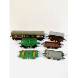 A Hornby 'O' gauge tinplate coach together with five goods wagons