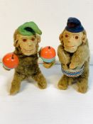 A pair of clockwork monkey musicians.