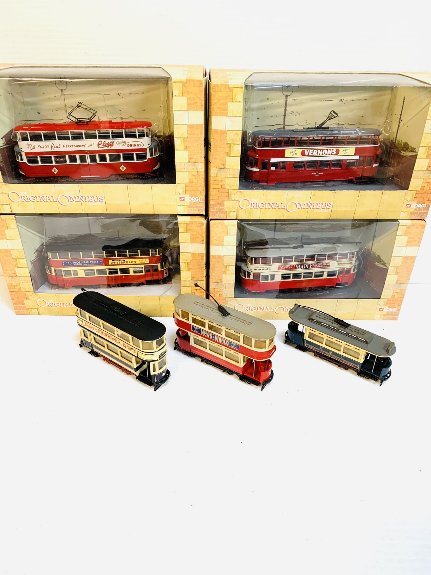 Collection of diecast Corgi model trams and omnibuses.