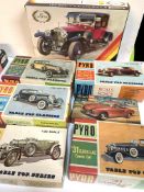 Seven boxed plastic car model kits