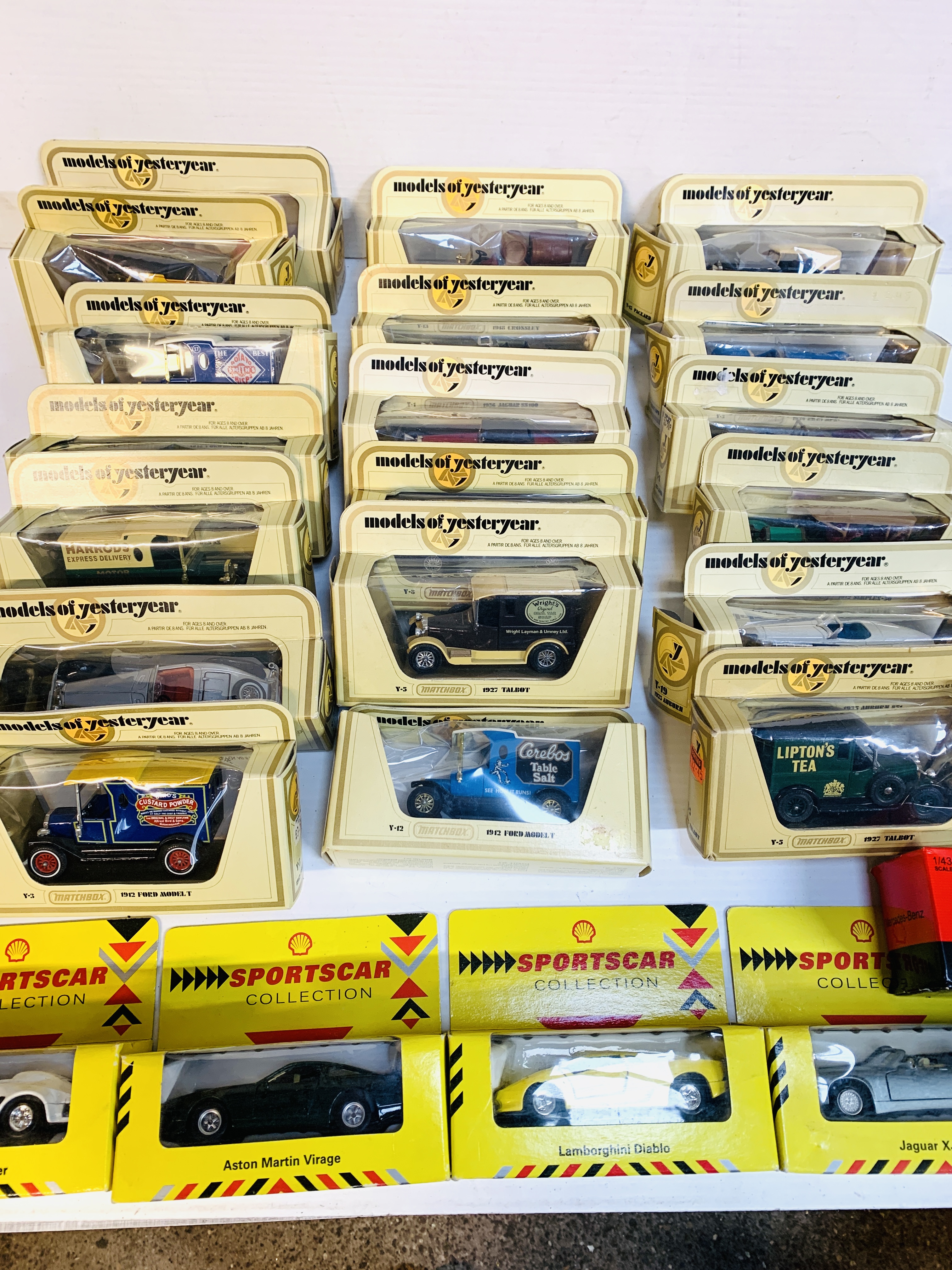 Nineteen boxed Matchbox Models of Yesteryear, including delivery vans and cars