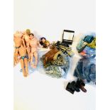 A collection of Action Man dolls, together with clothing and accessories.