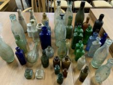 Quantity of approximately 50 antique glass and stoneware bottles