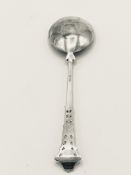 A hallmarked silver serving spoon by Stuart Clifford & Co