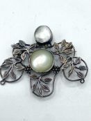 Victorian mourning brooch and three silver brooches