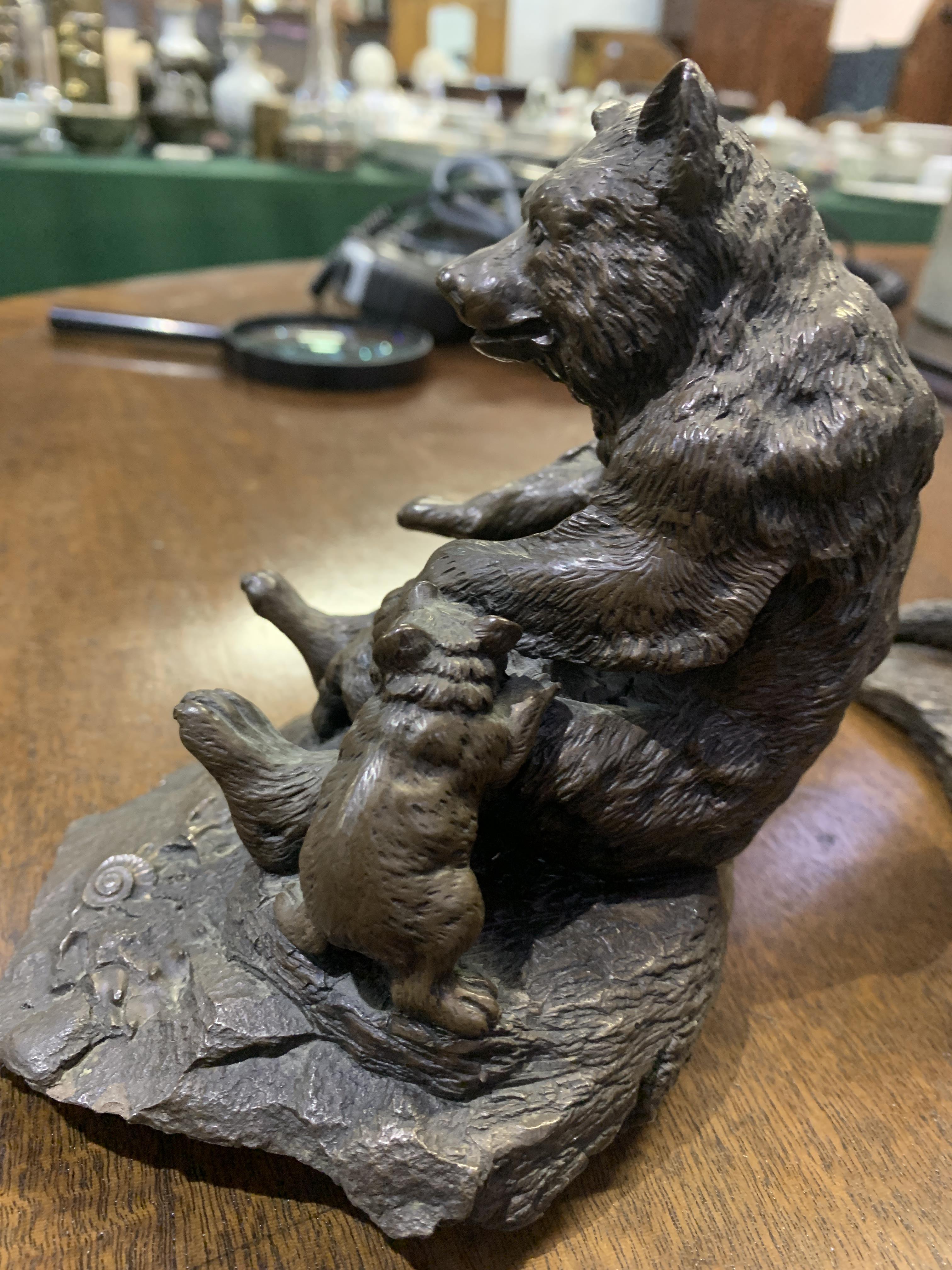 Bronze coloured metal figurine of a bear and three otter figurines - Image 3 of 4