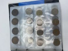 A coin album containing a collection of mixed GB and foreign coins