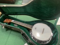 Barnes and Mullins four string Banjo Ukulele in green lined hard case