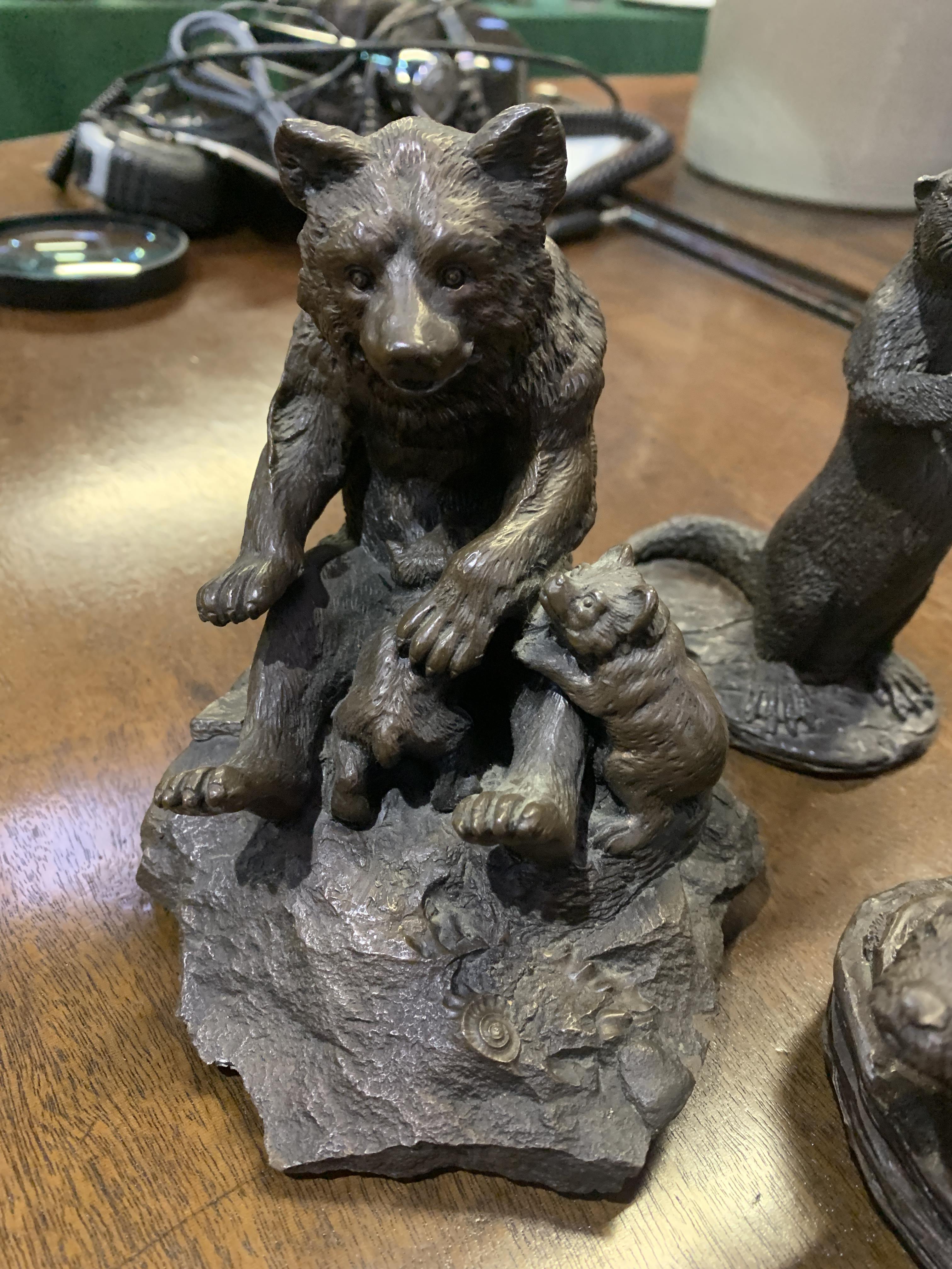 Bronze coloured metal figurine of a bear and three otter figurines - Image 2 of 4