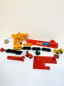 A Matchbox model container ship loader with a quantity of model diecast vehicles.