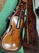 Violin labelled 'Antonius Stradivarius Cremonensis Faciebat Anno 17' with bow, with another violin