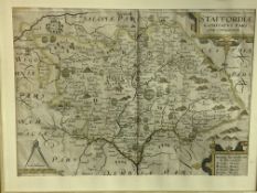 Framed and glazed partially coloured print of a map of Staffordshire