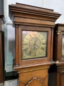 Oak longcase clock with brass face engraved Chas Winn Hinstock