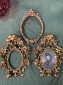 Pair of carved wood picture frames, together with a gilt frame
