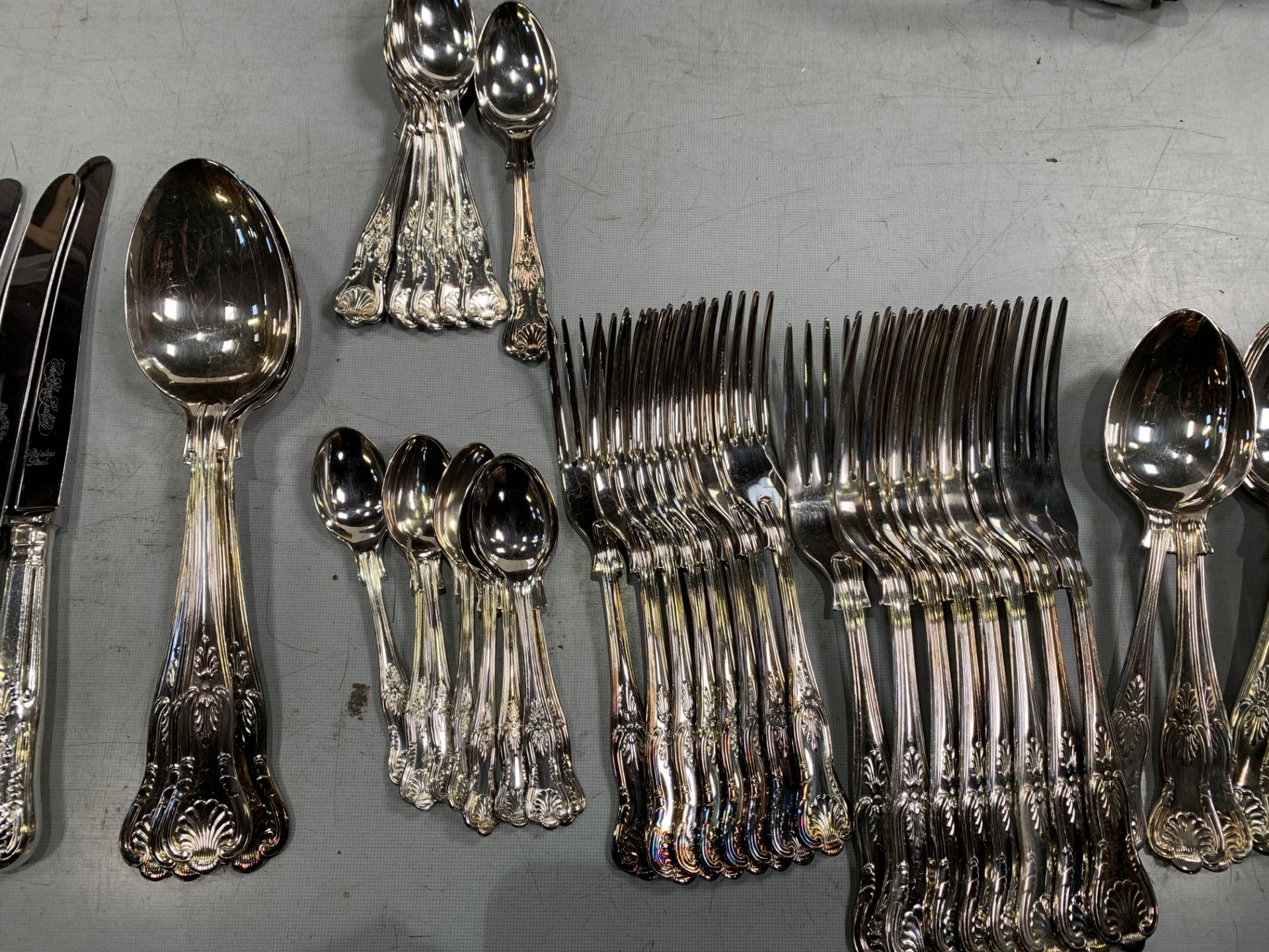 Eight place settings of silver plate cutlery