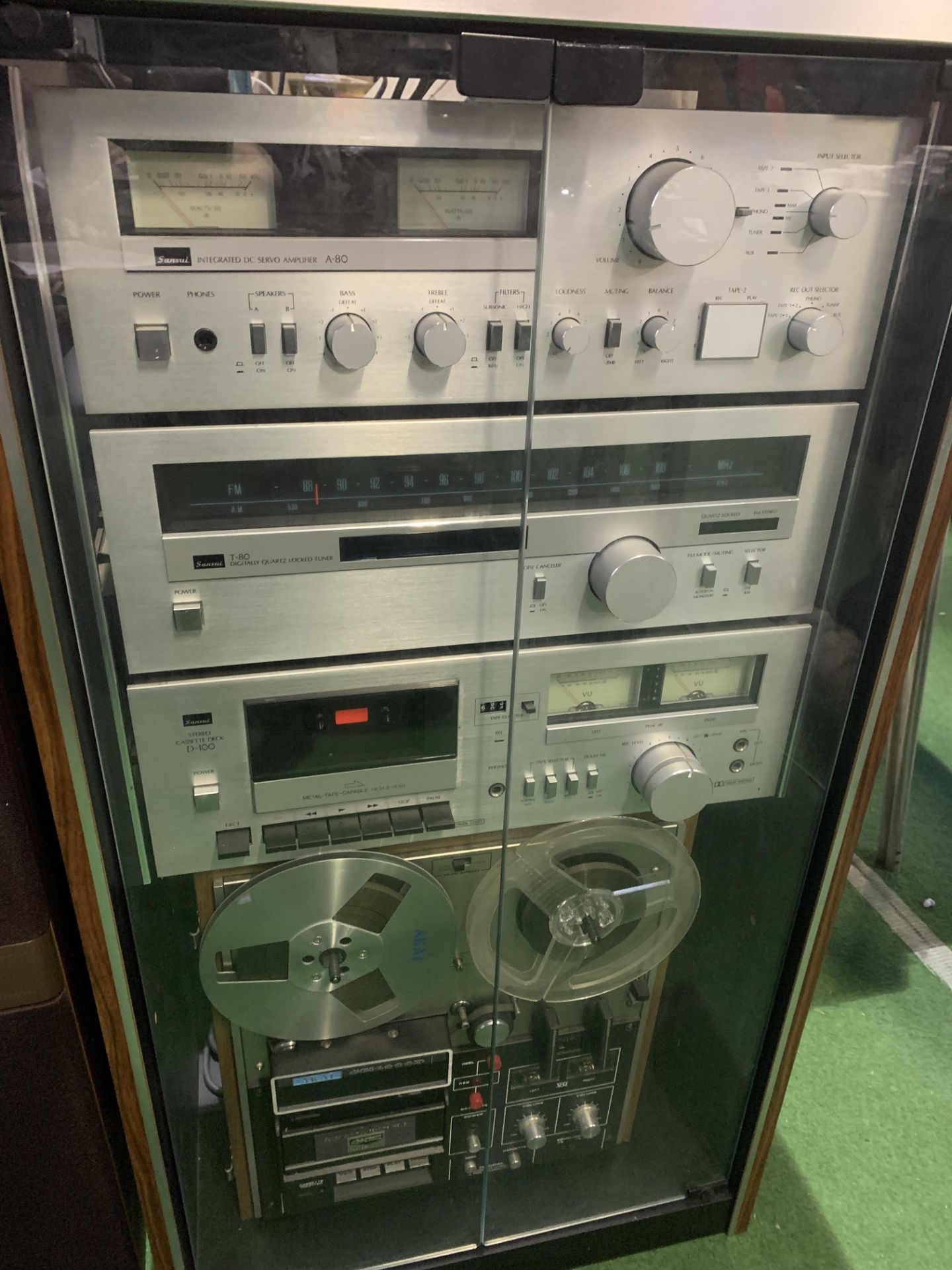 Cabinet containing a Sansui hi-fi system
