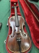 Violin and bow in red lined hard case, together with a hard violin case containing two bows.
