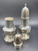 A pair of hallmarked silver sugar casters