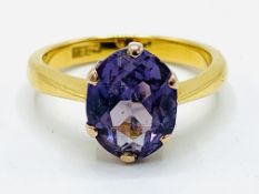 22ct gold ring set with an hexagonal faceted colour changing synthetic sapphire