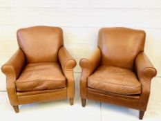 Pair of brown leather armchairs