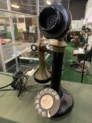 Candlestick telephone with brass earpiece