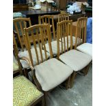 Six teak frame rail back dining chairs