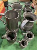 Nine pewter tankards