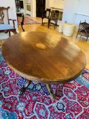 Oval mahogany tilt top table