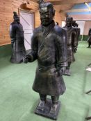 A Qin style terracotta figure of a standing soldier