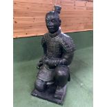 A Qin style terracotta figure of a kneeling archer