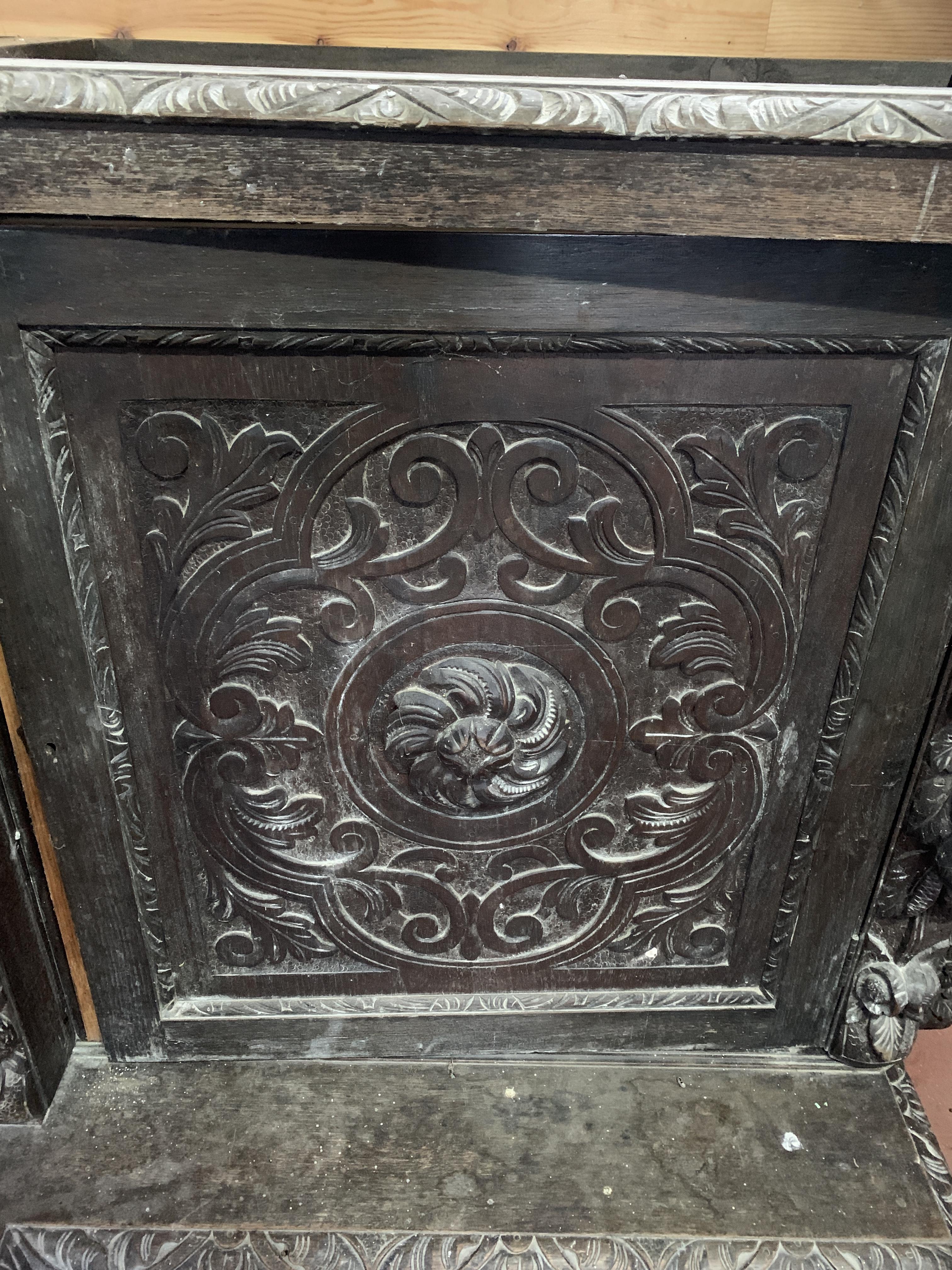 Victorian heavily carved glazed bookcase over four cupboards - Image 4 of 10