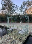 Wrought iron arbour with seats
