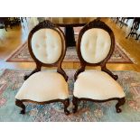 A pair of spoon back bedroom chairs