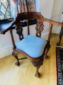 Pair of carved hardwood corner chairs