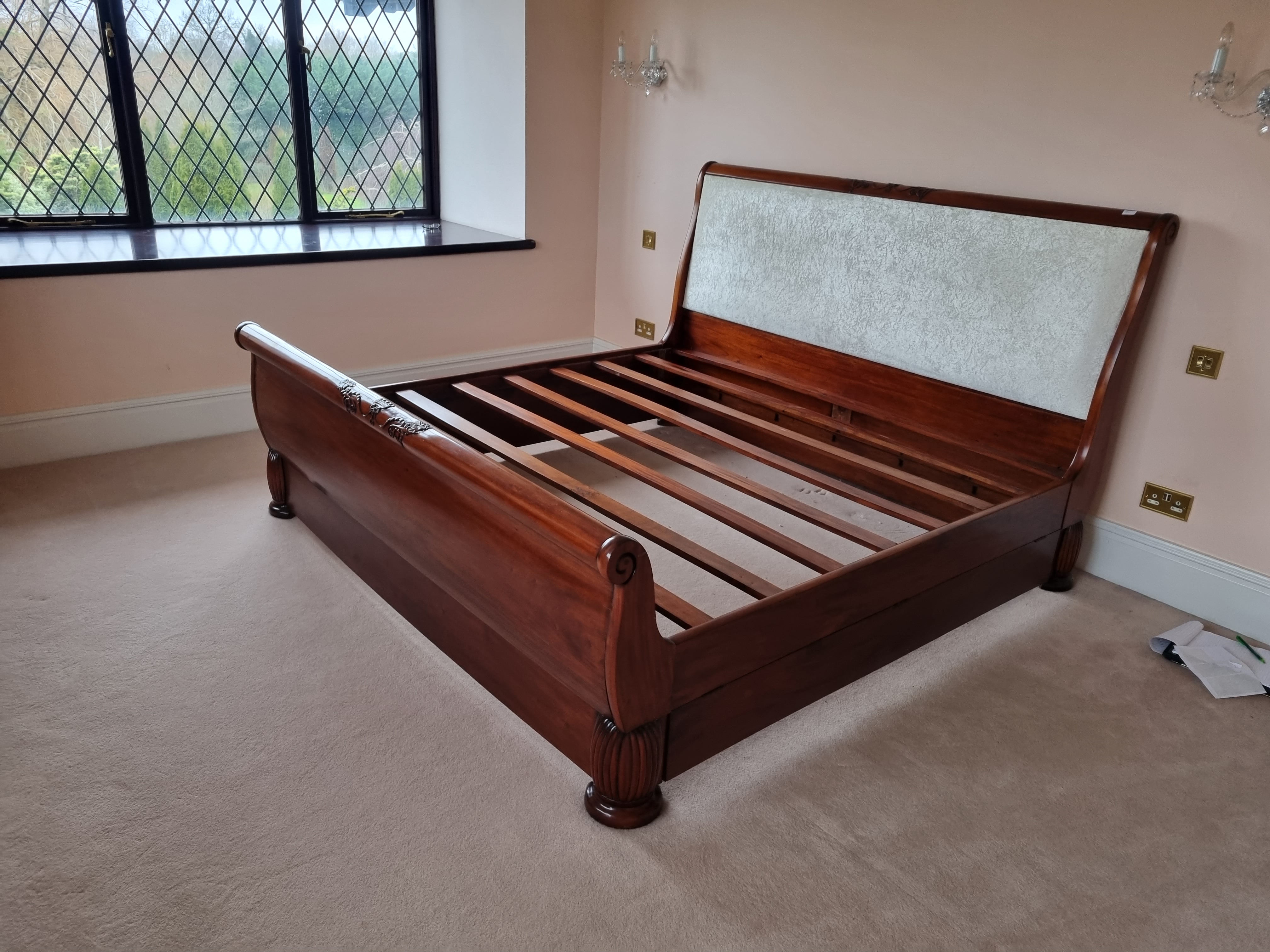 Mahogany sleigh bed with fabric headboard