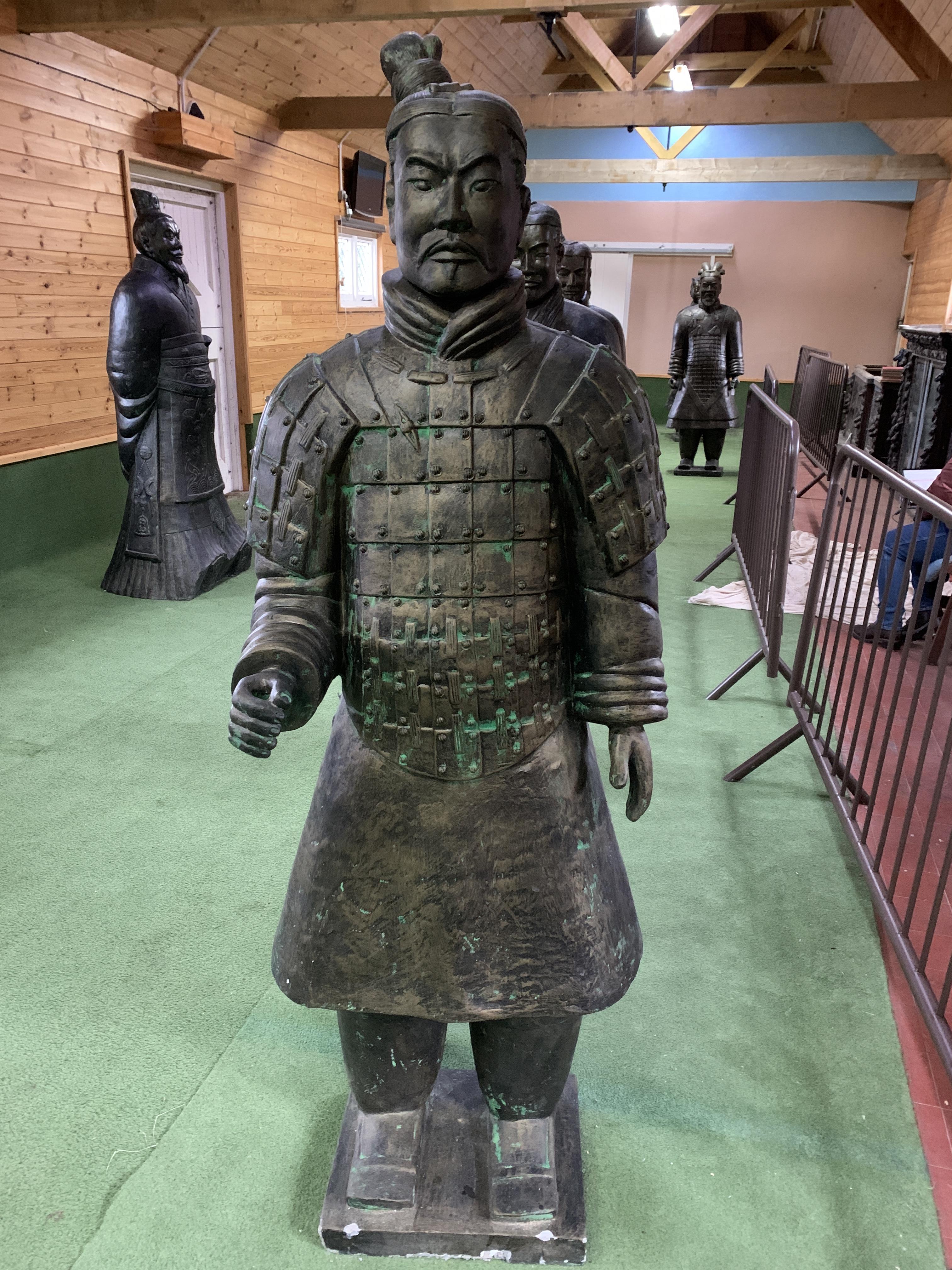 A Qin style terracotta figure of a lightly armed warrior