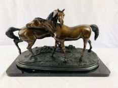 Bronze sculpture of two horses, on a marble base