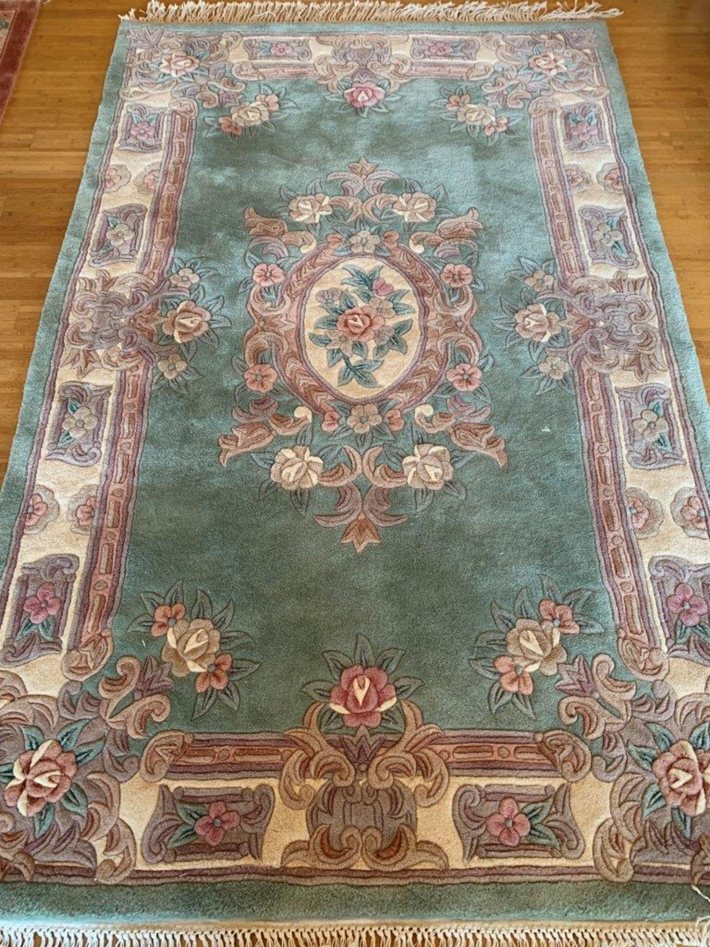 Pale green ground rug