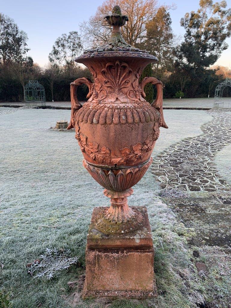 Pair of terracotta two handled lidded urns on plinths - Image 2 of 5