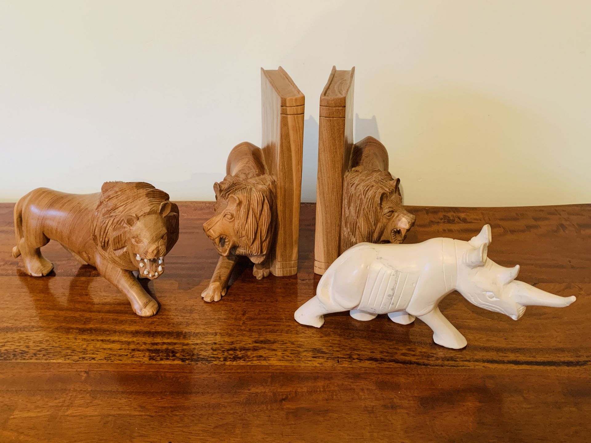 Pair of carved wood lion bookends and other items